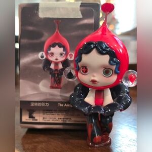 Red and Black Action Figure with Unique Design